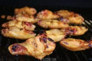 cooked chicken wings on grill grate inside the grill