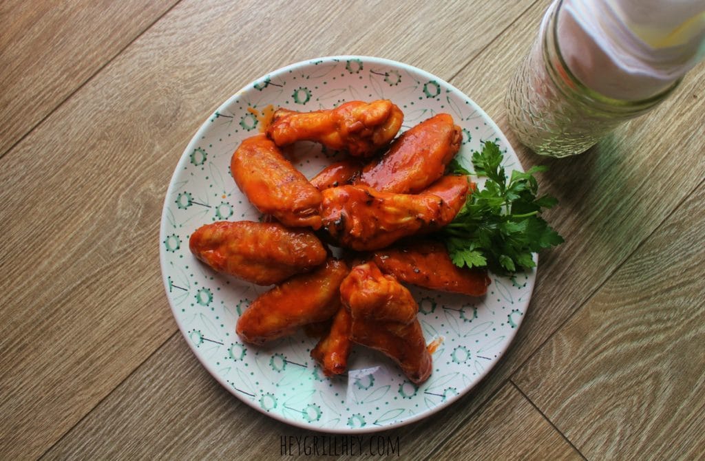 Ultimate Smoked Buffalo Chicken Wings on a white plate.