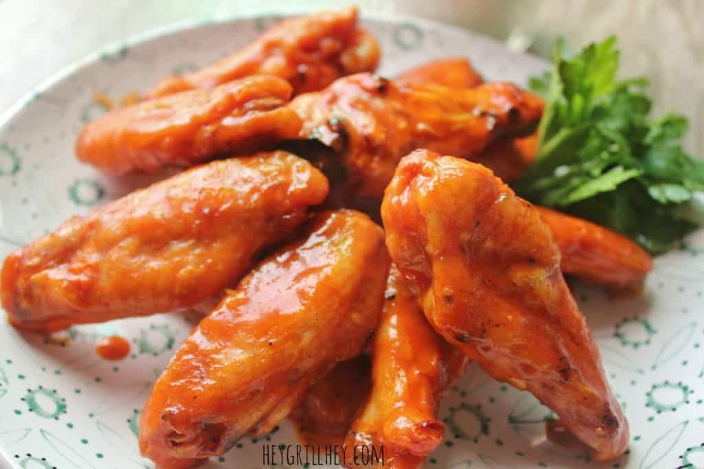 Ultimate Smoked Buffalo Chicken Wings on a white plate.