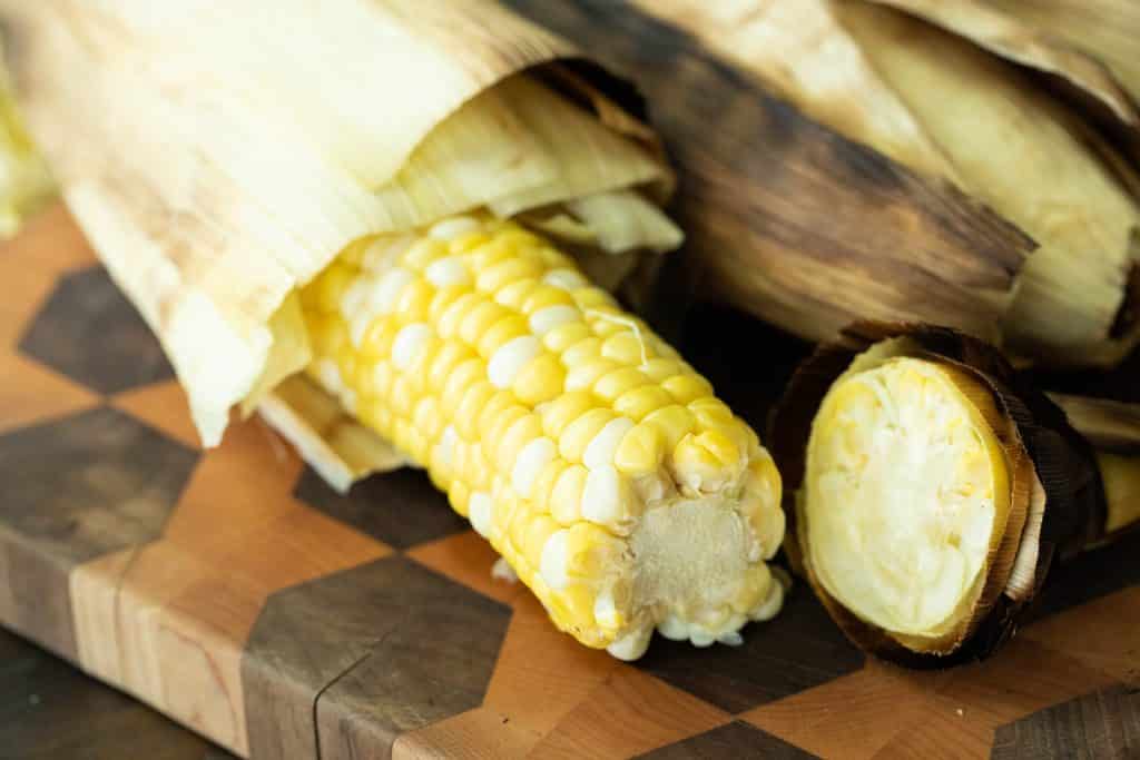 peeled easy grilled corn on the cob on a cutting board