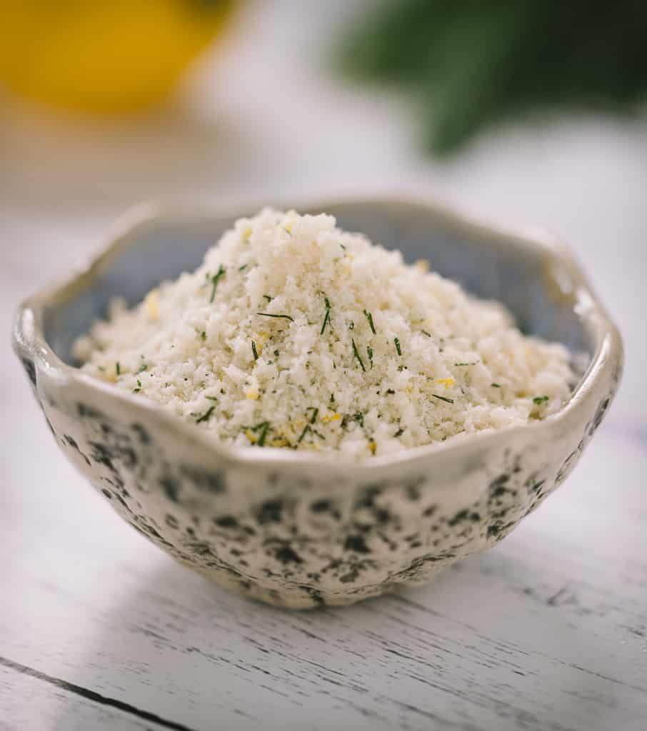Shredded parmesan and seasonings in a small bowl.