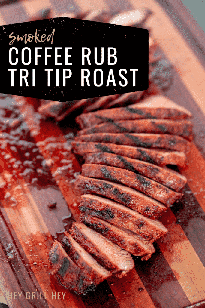 Coffee rub tri tip on a wooden cutting board. Text overlay: "Smoked Coffee Rub Tri Tip Roast."