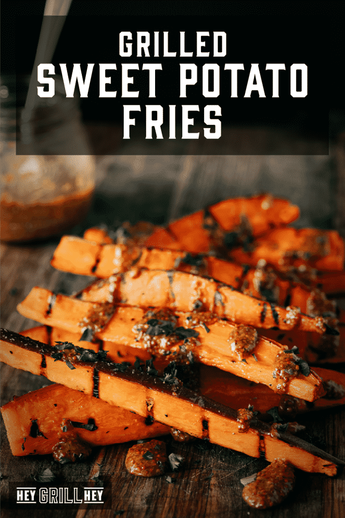 Grilled sweet potato fries drizzled with honey mustard sauce with text overlay - Grilled Sweet Potato Fries.
