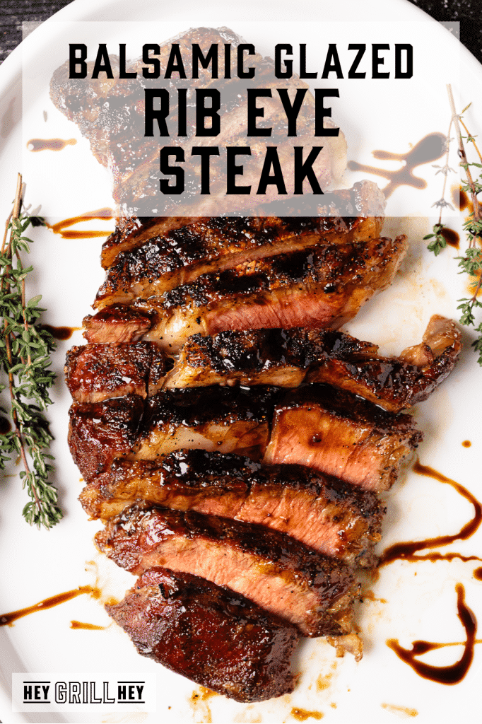 Sliced grilled rib eye steak with text overlay - Balsamic Glazed Rib Eye Steak.