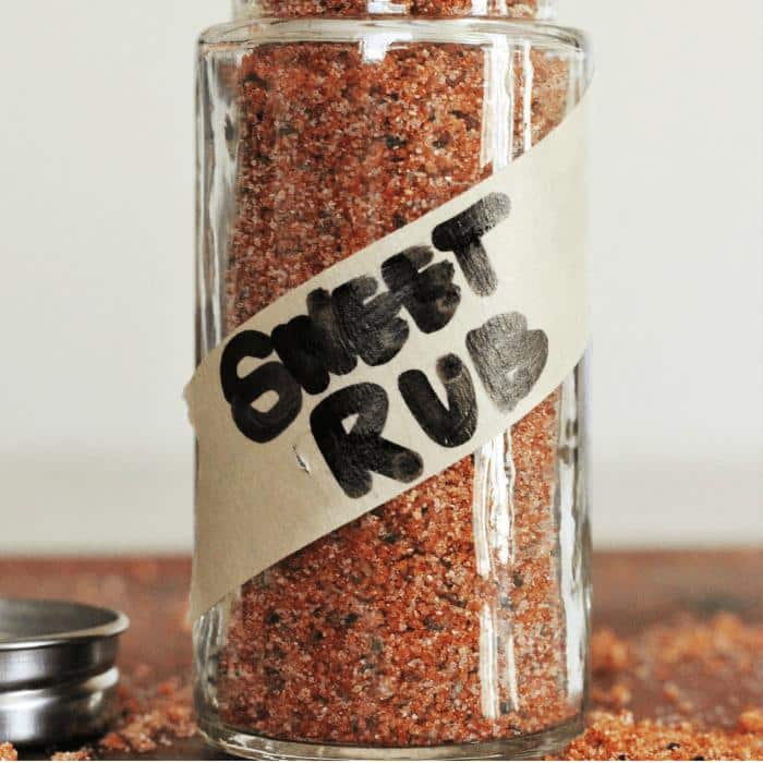 The best sweet rub in a glass jar with the words "sweet rub" written in black marker across masking tape across the jar.