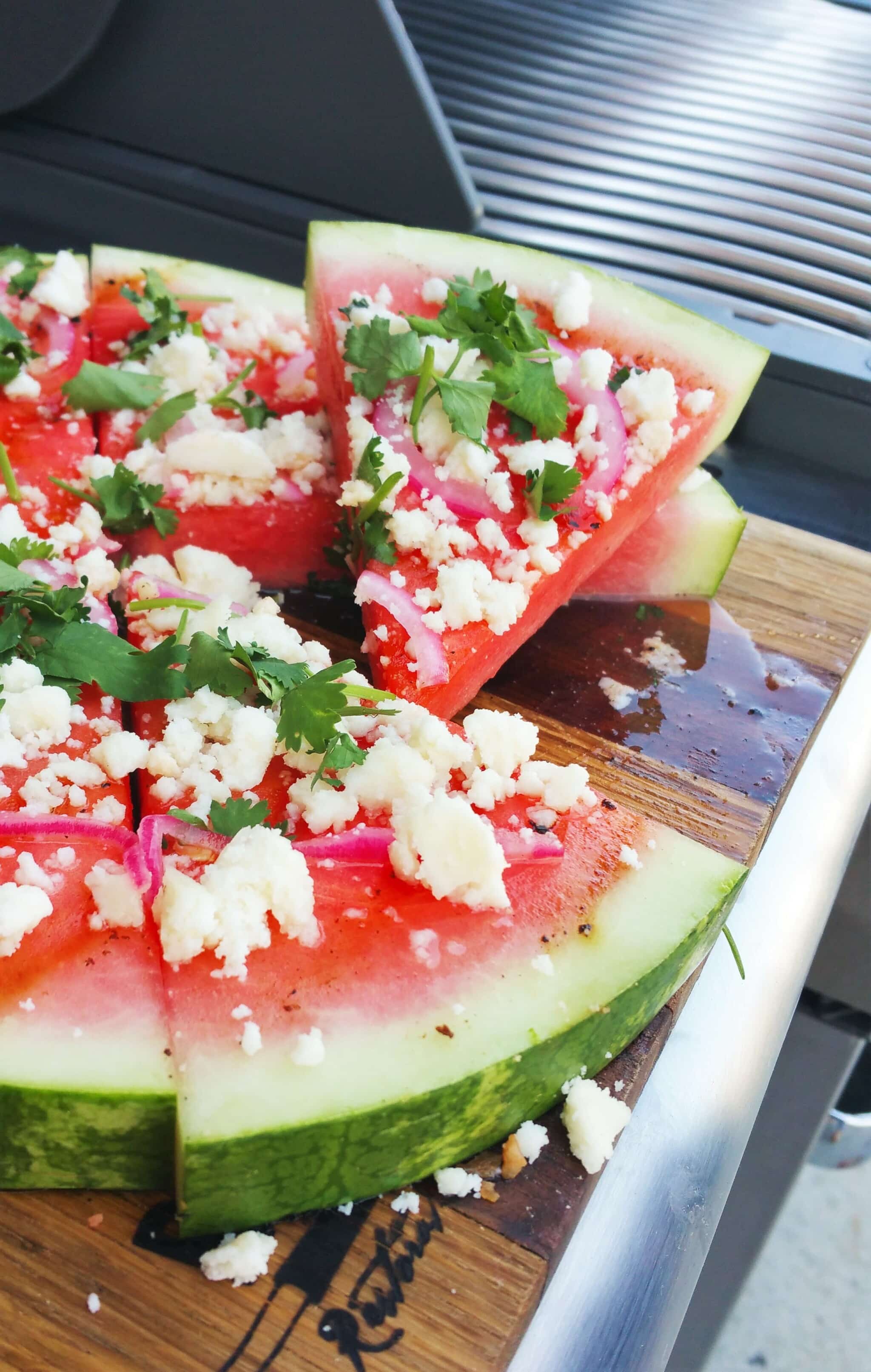 Grilled Watermelon Pizza with cilantro, queso fresco, pickled red onion and fresh lime.