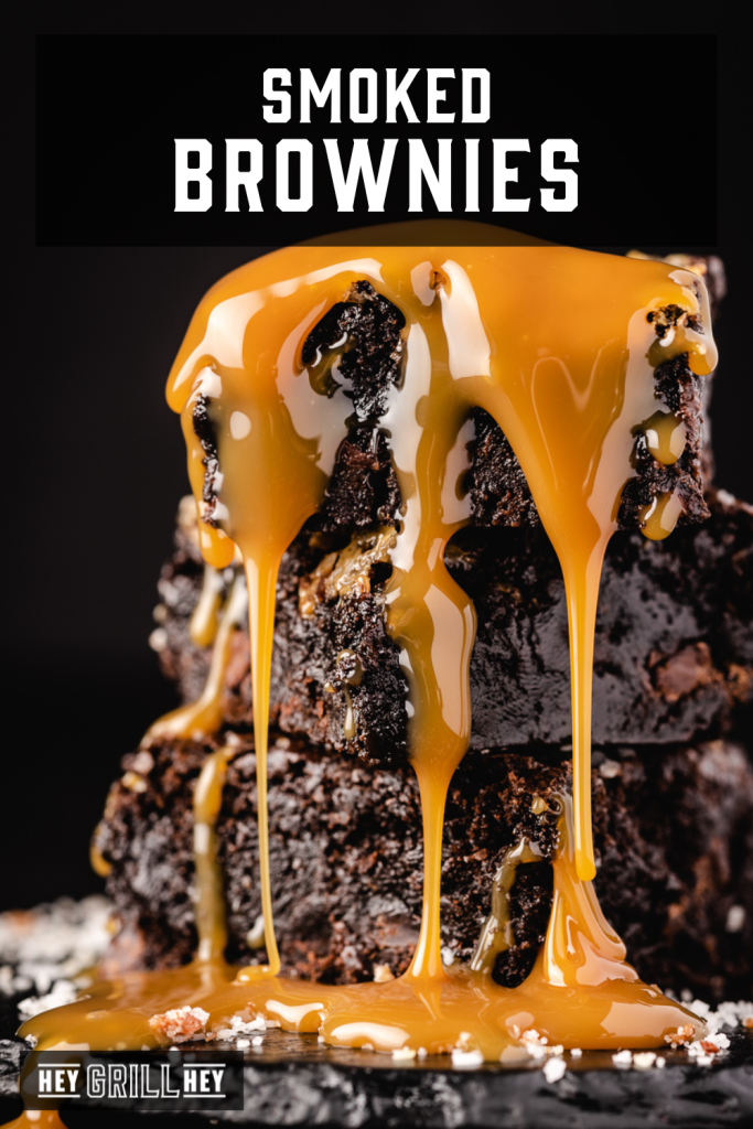 Stack of smoked brownies with caramel drizzing down them with text overlay - Smoked Brownies.
