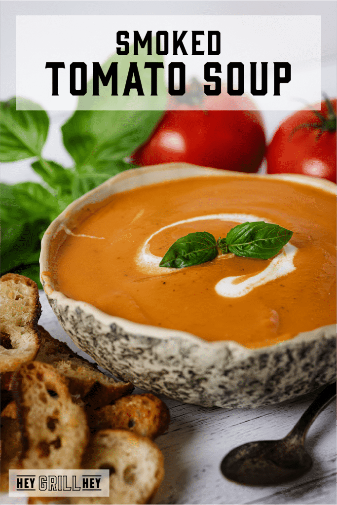 Bowl of smoked tomato soup with text overlay - Smoked Tomato Soup.