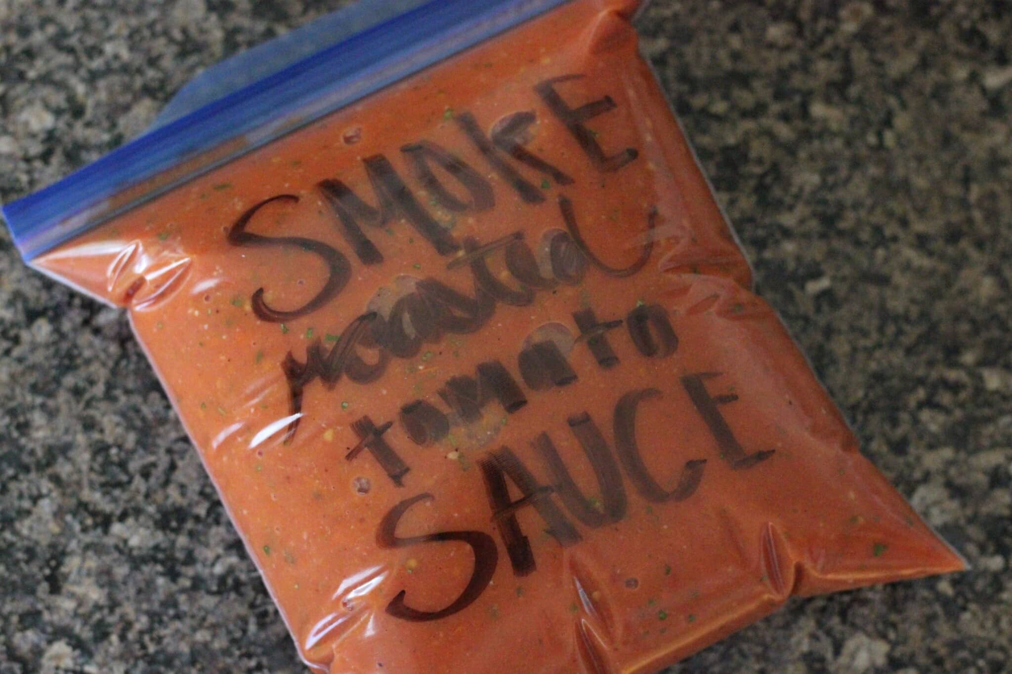 smoke roasted tomato sauce in a zip top bag.