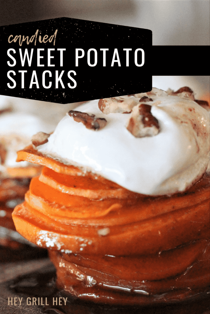 Candied sweet potato stack topped with marshmallow fluff and pecans. Text overlay reads: Candied Sweet Potato Stacks.