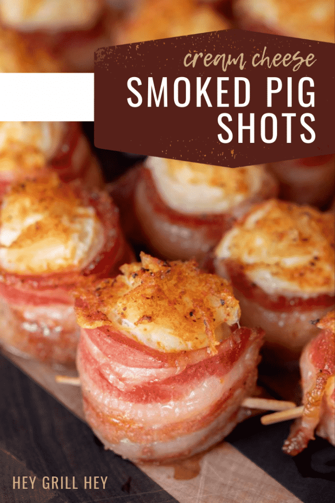 Bacon wrapped cream cheese topped with pineapple. Text overlay says "Cream Cheese Smoked Pig Shots."