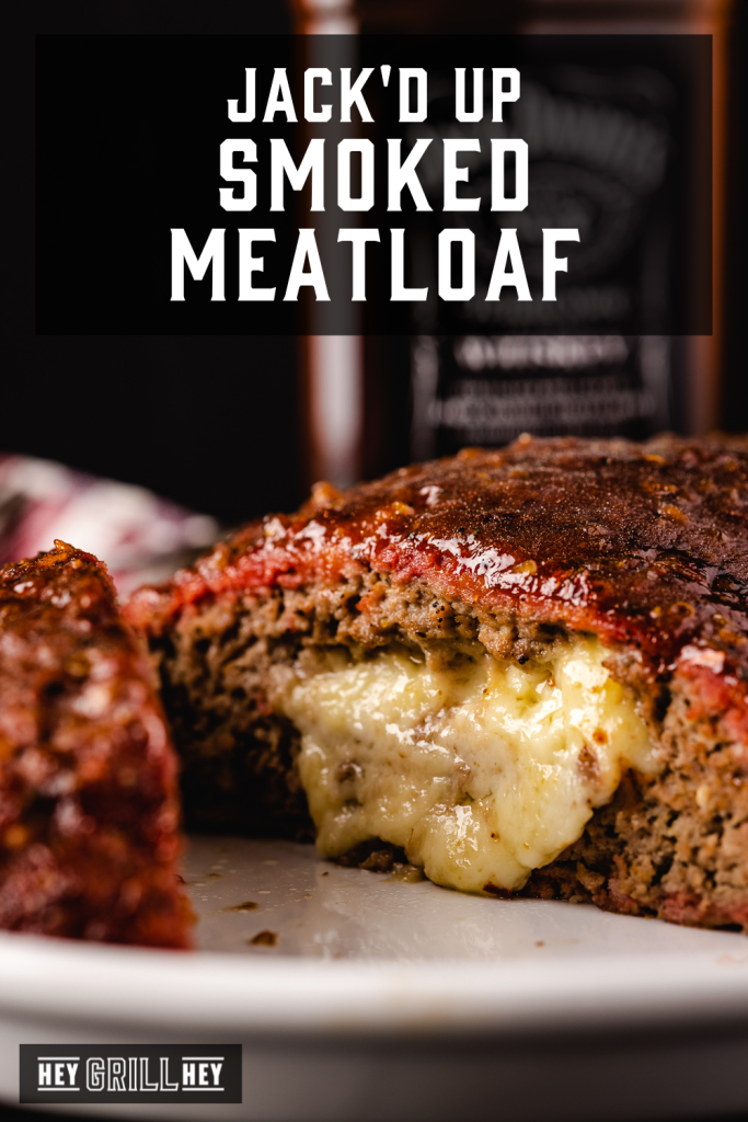 Smoked meatloaf sliced on a white serving plate with text overlay - Jack'd Up Smoked Meatloaf.