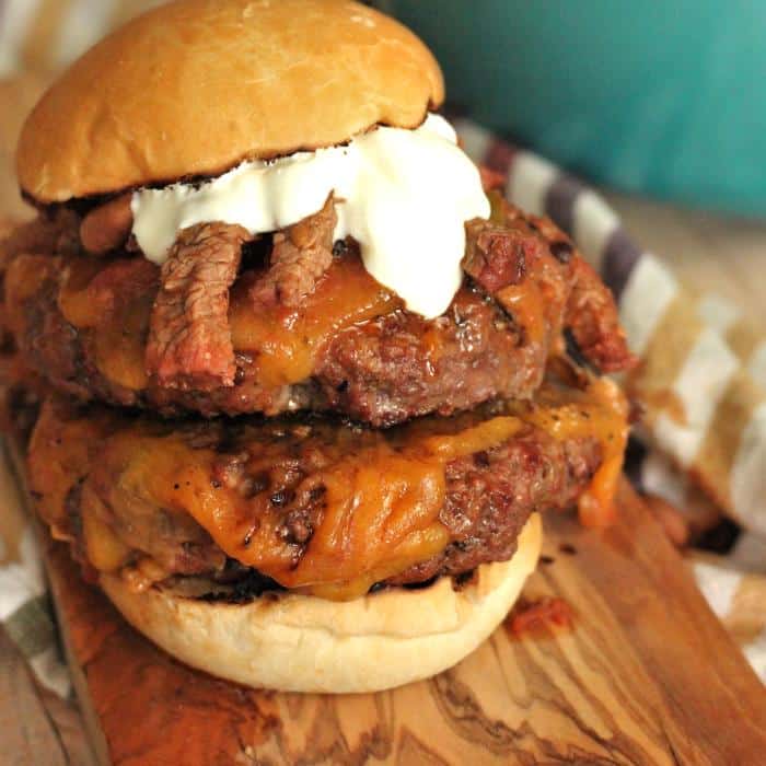 Cheeseburger on a bun with strips of steak