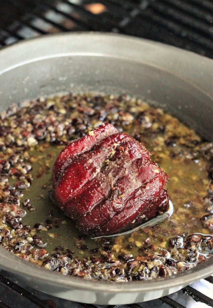 Venison Steak in a frying pan.