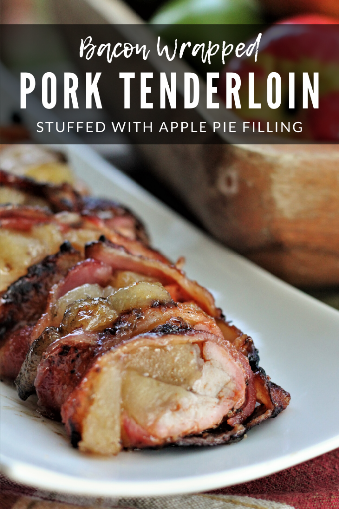 Bacon Wrapped Pork Tenderloin with Apples served on a white plate. Text overlay reads "Bacon Wrapped Pork Tenderloin Stuffed with Apple Pie Filling."