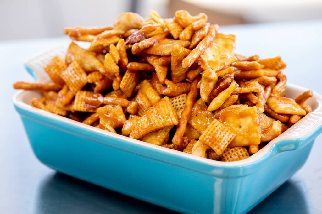 Smoked snack mix in a blue baking dish.
