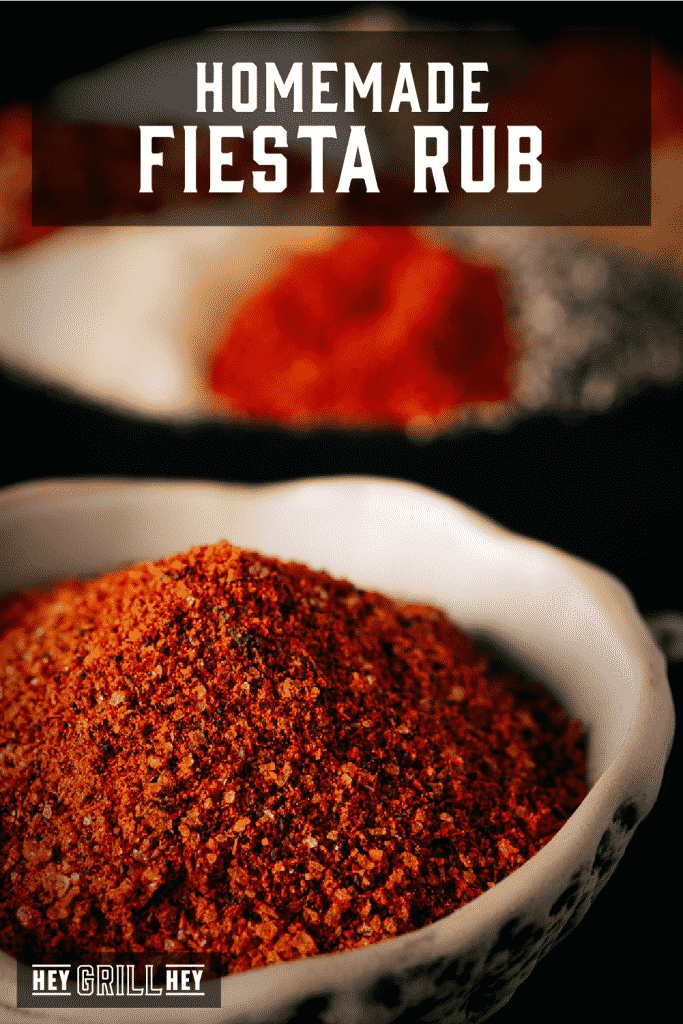 Bowl of fiesta rub with ingredients for fiesta rub in the background.