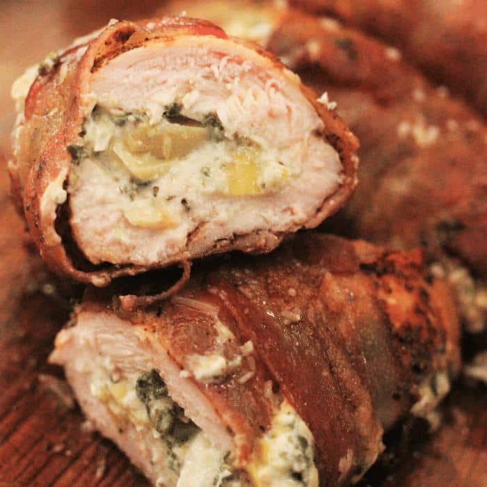 sliced and stacked spinach artichoke stuffed chicken