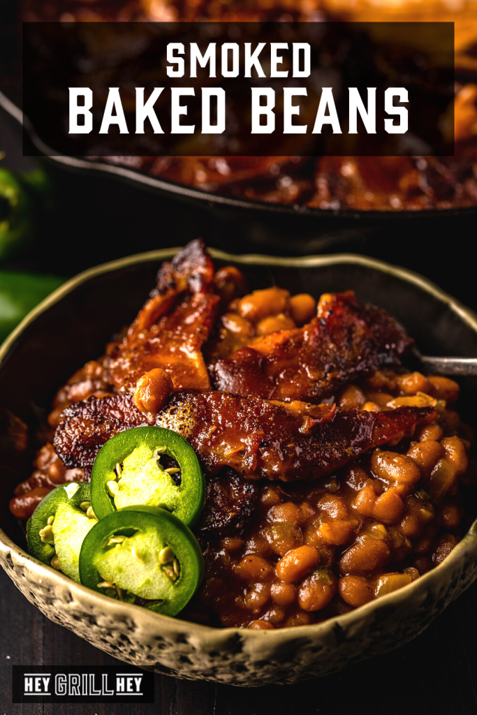 Smoked baked beans in a serving dish with text overlay - Smoked Baked Beans.