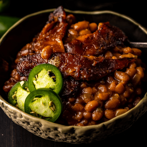 Smoked baked beans in a serving dish.