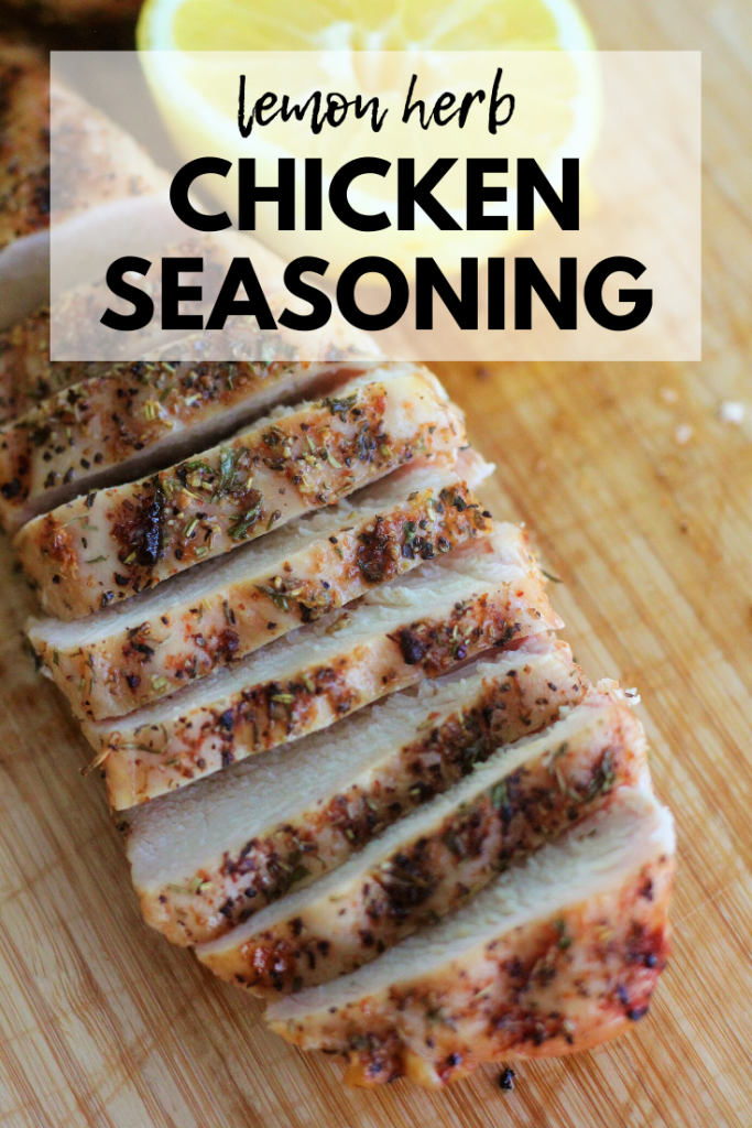 Sliced and seasoned chicken breast on a wooden cutting board with half a lemon in the background. Text overlay: "Lemon Herb Chicken Seasoning."