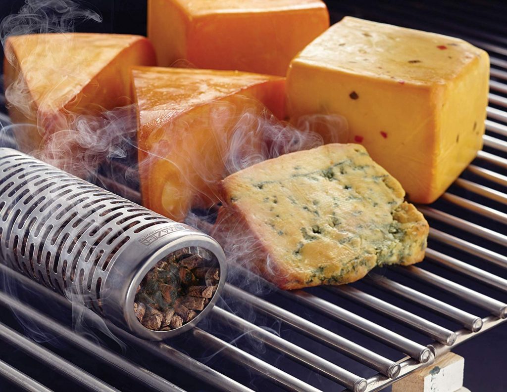 cheese blocks on a grill with a pellet tube.