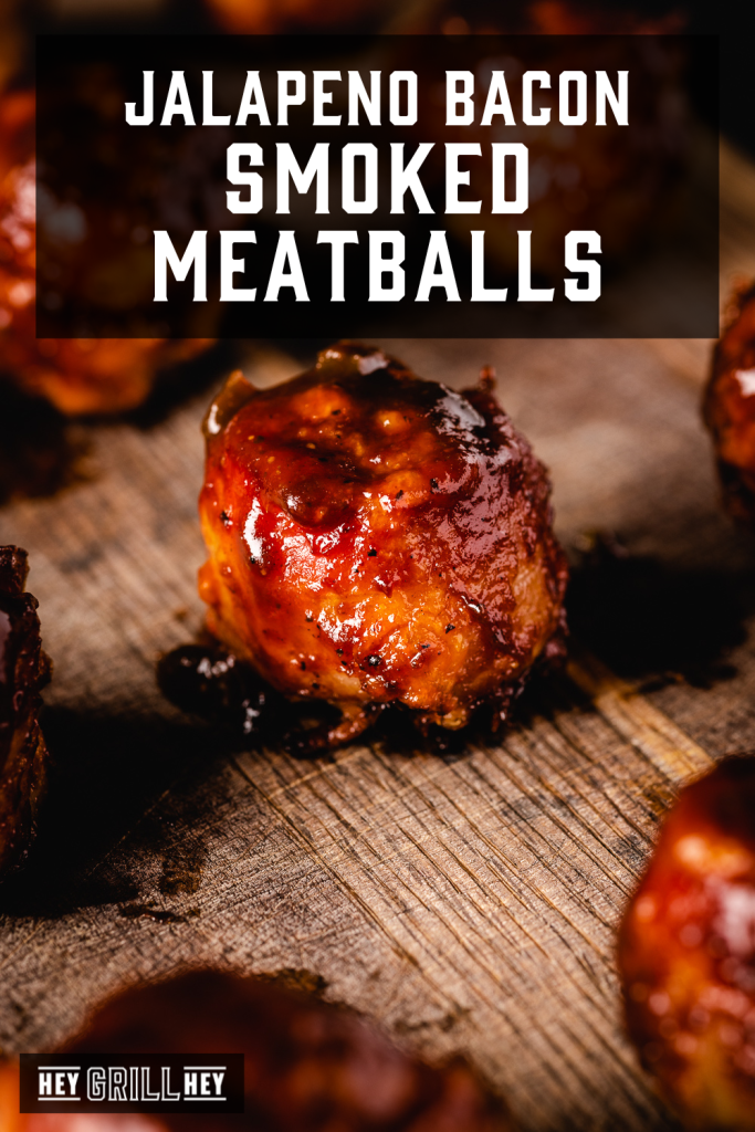 Smoked meatballs on a serving platter with text overlay - Jalapeno Bacon Smoked Meatballs.