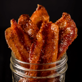 Candied bacon in a glass mason jar.