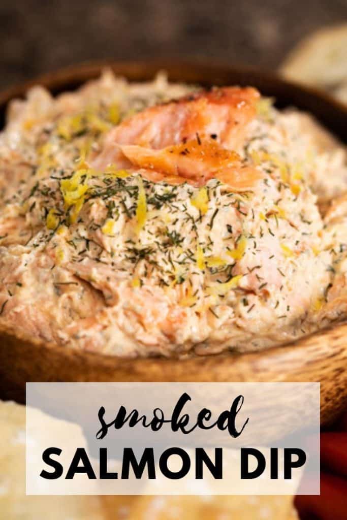 wooden bowl with smoked salmon dip and garnished with flakes of smoked salmon.