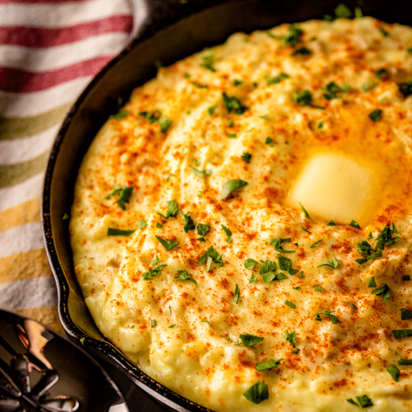 Smoked mashed potatoes in a cast iron skillet.