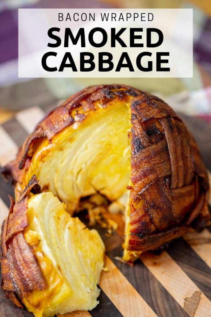 bacon wrapped smoked cabbage on a wooden cutting board