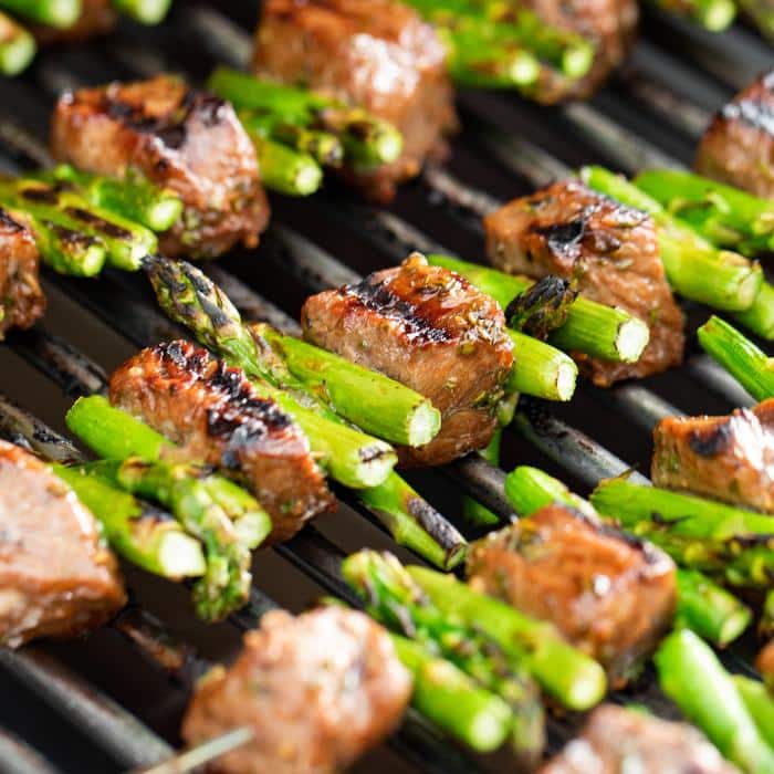 steak and asparagus kabobs on the grill
