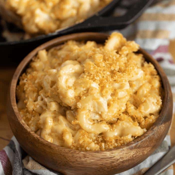 Wooden bowl of smoked mac and cheese.