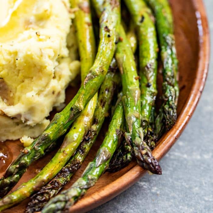 grilled asparagus in bowl with smoked mashed potaotes