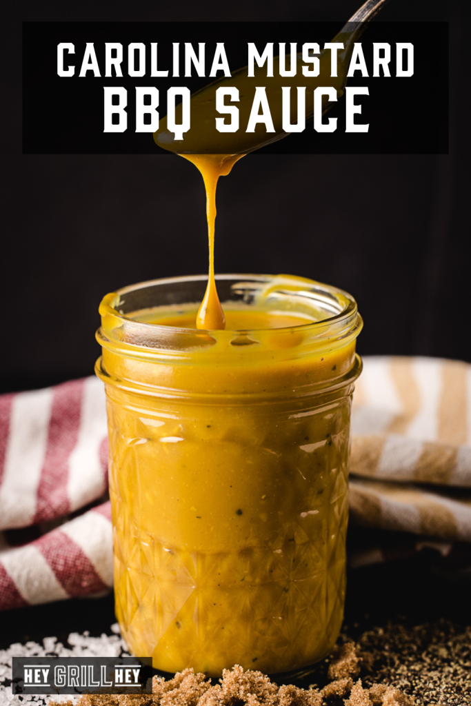 Carolina Mustard BBQ Sauce in a glass mason jar with text overlay - Carolina Mustard BBQ Sauce.