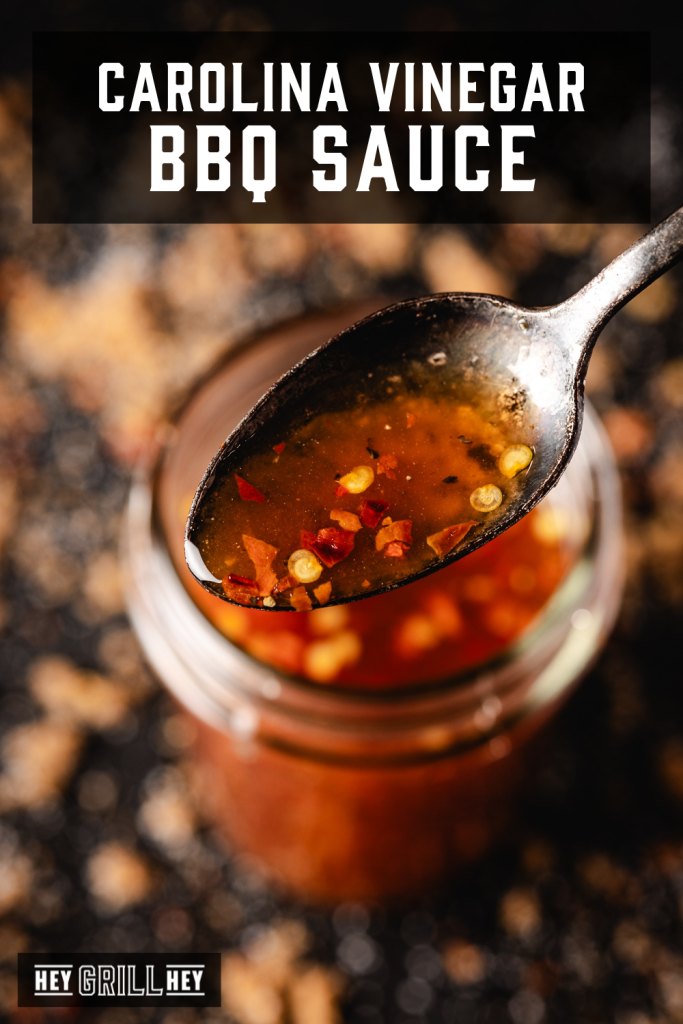 Carolina vinegar BBQ sauce on a metal spoon with text overlay - Carolina Vinegar BBQ Sauce.
