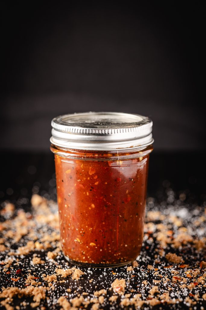 Carolina vinegar BBQ sauce in a glass mason jar.