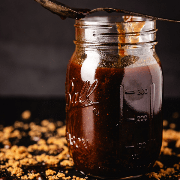Coffee BBQ Sauce in a glass mason jar.
