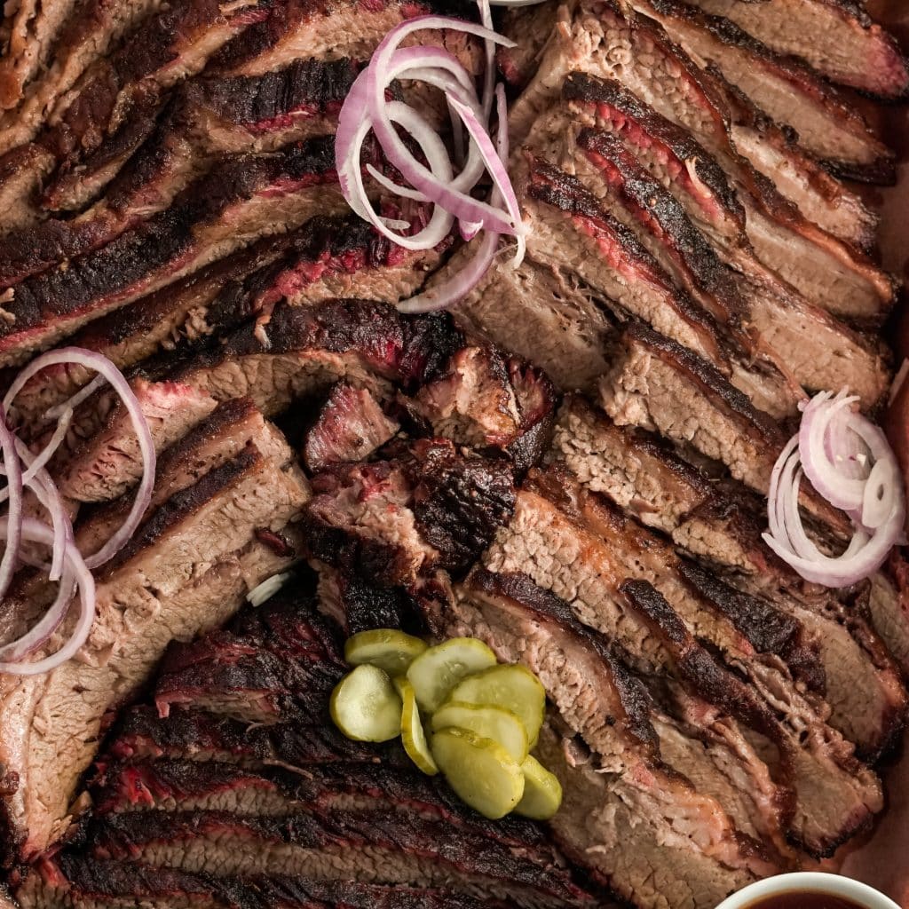 coffee rub brisket with pickled red onions and pickles