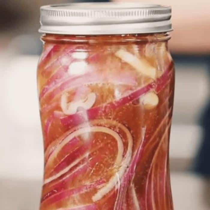 Sealed jar of pickled red onions