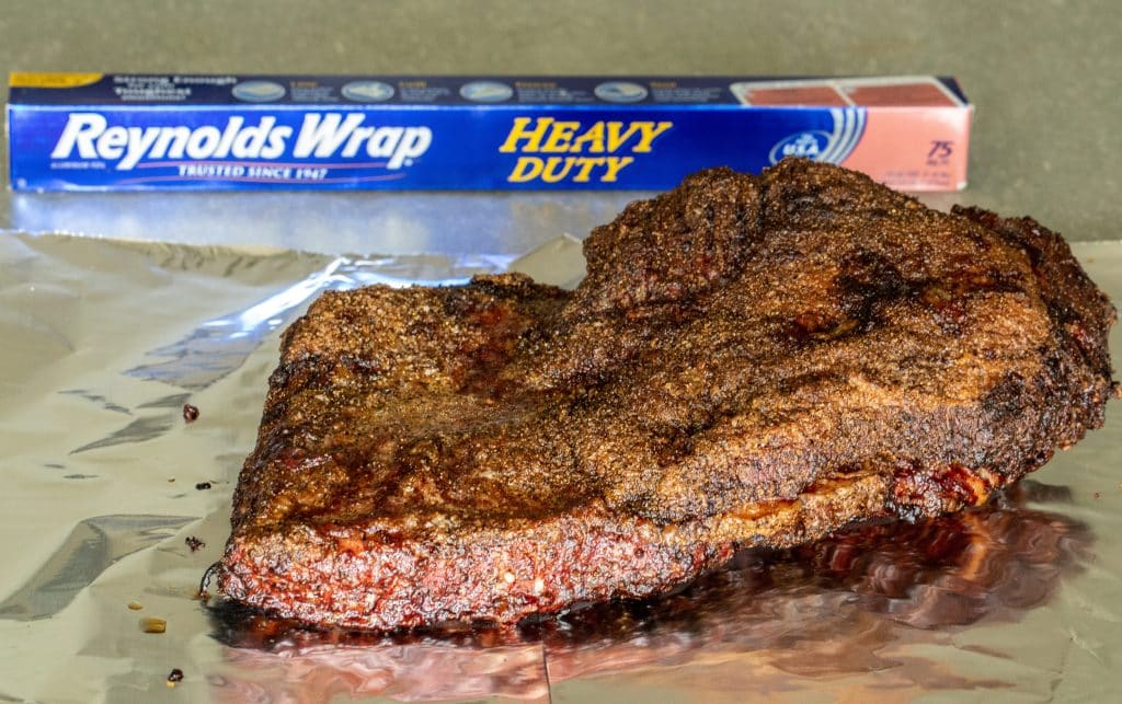 smoked beef brisket on Reynolds Wrap heavy duty foil.