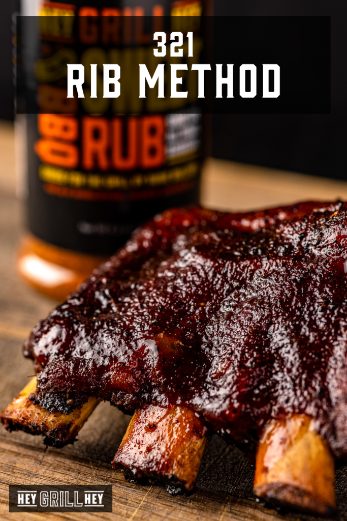 321 ribs on a wooden cutting board with text overlay - 321 Rib Method.