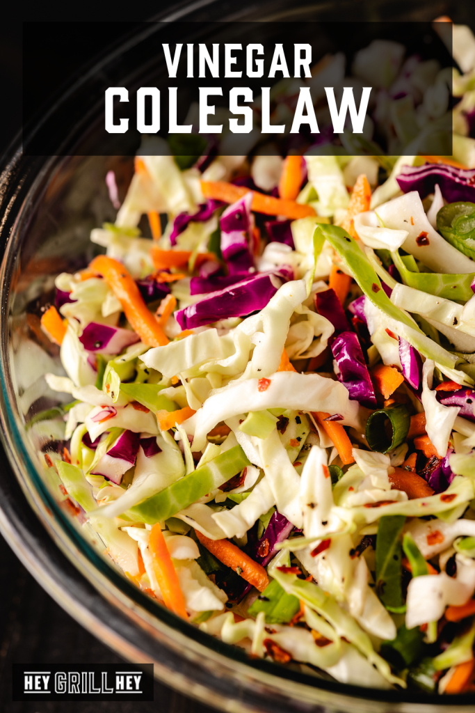 Vinegar coleslaw in a glass dish with text overlay - Vinegar Coleslaw.