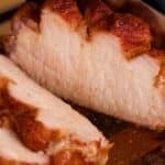 A closeup shot of a sliced, smoked pork loin.