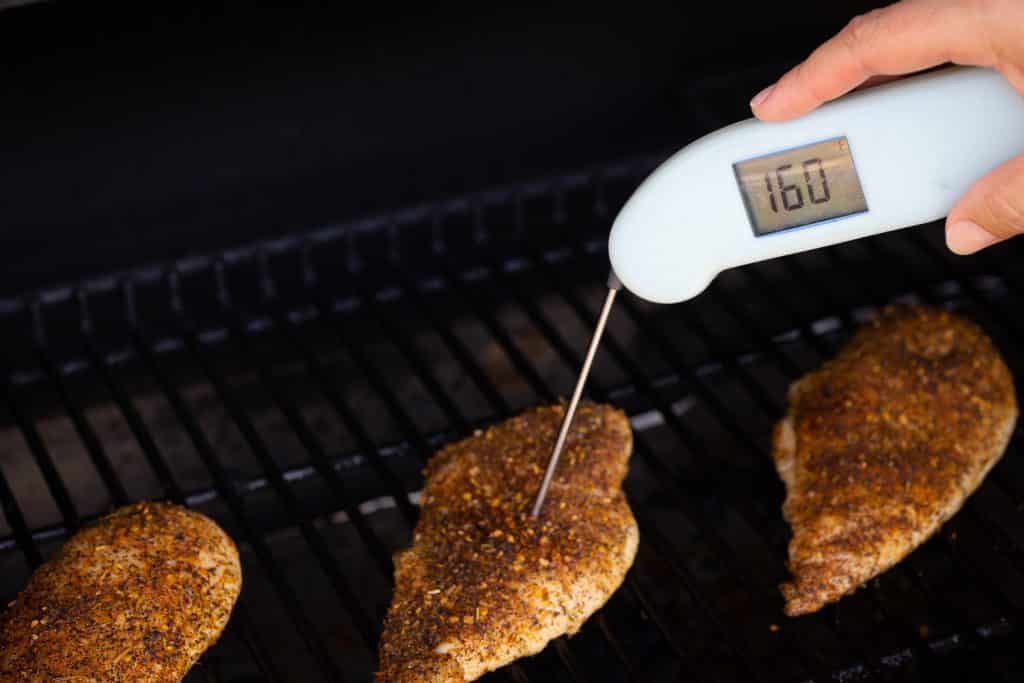 Chicken breasts reading a temperature of 160 degrees F.