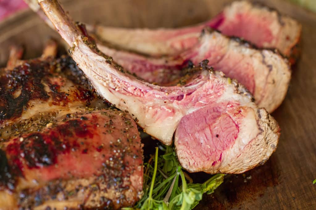 grilled rack of lamb sliced into individual chops.
