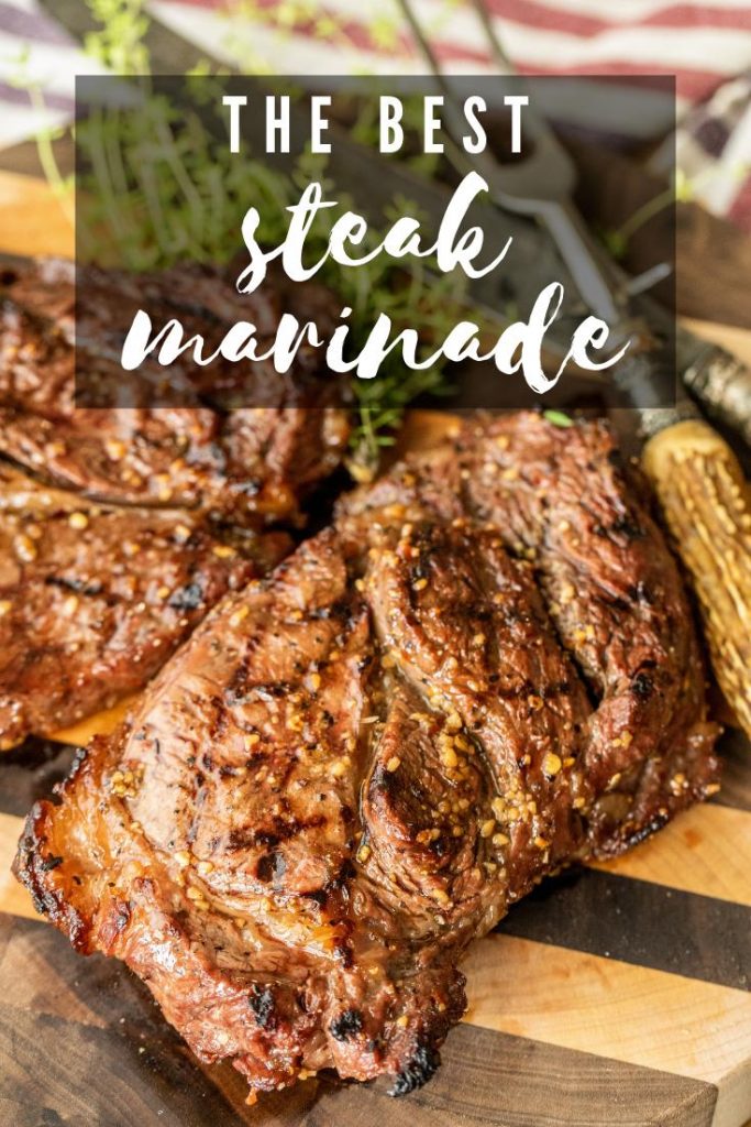 Grilled marinated steak on a cutting board.