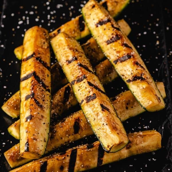 Zucchini spears with grill marks sprinkled with sea salt.