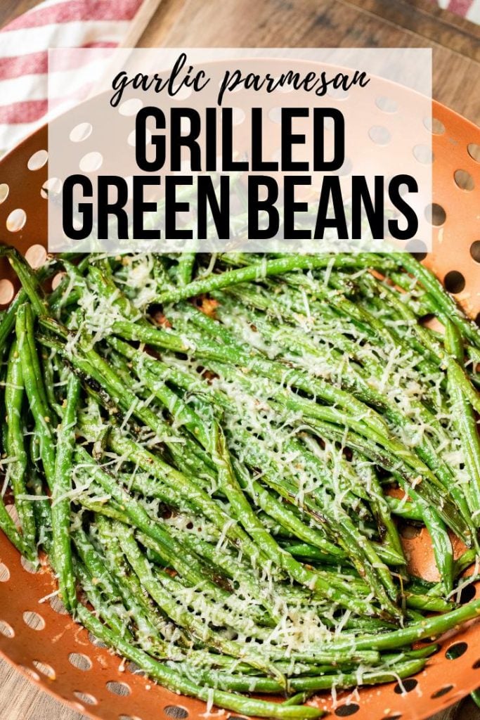 garlic and parmesan seasoned grilled green beans in a cooking basket.