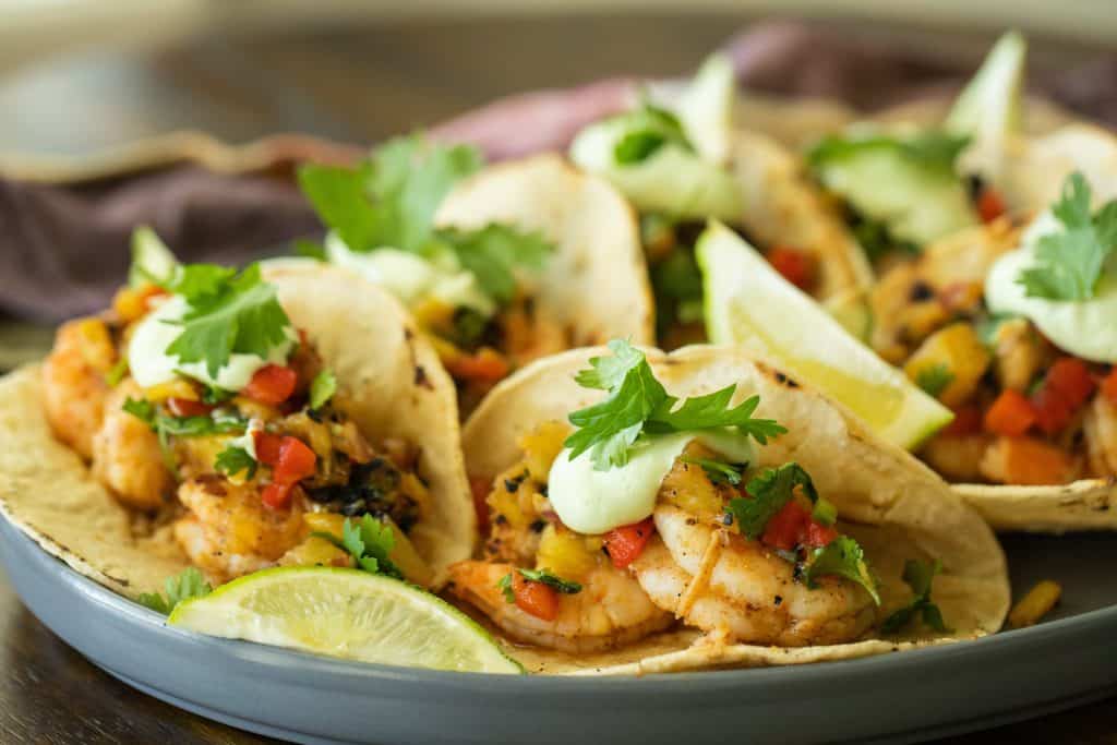 Grilled shrimp tacos on a platter.